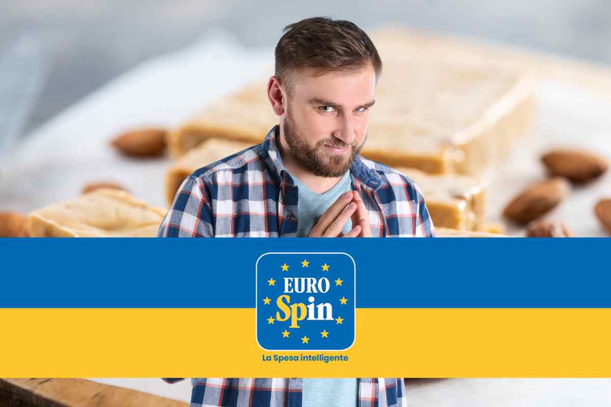 Uomo davanti a torroncini e dietro un logo Eurospin