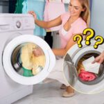 Donna mette i panni a lavare