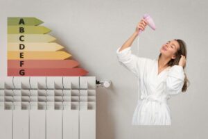 calorifero con tabella energetica e donna che asciuga i capelli con phon